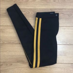 Yellow stripped black leggings
